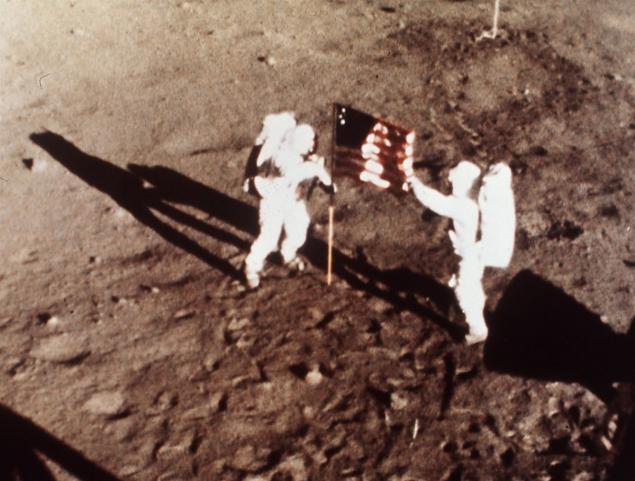Man on the moon - Apollo 11 astronauts Neil Armstrong and Edwin E. "Buzz" Aldrin, the first men to land on the moon, plant the U.S. flag on the lunar surface.